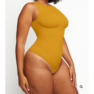 Extra large sleeveless bodysuit with support tags on made by feelin girl orange